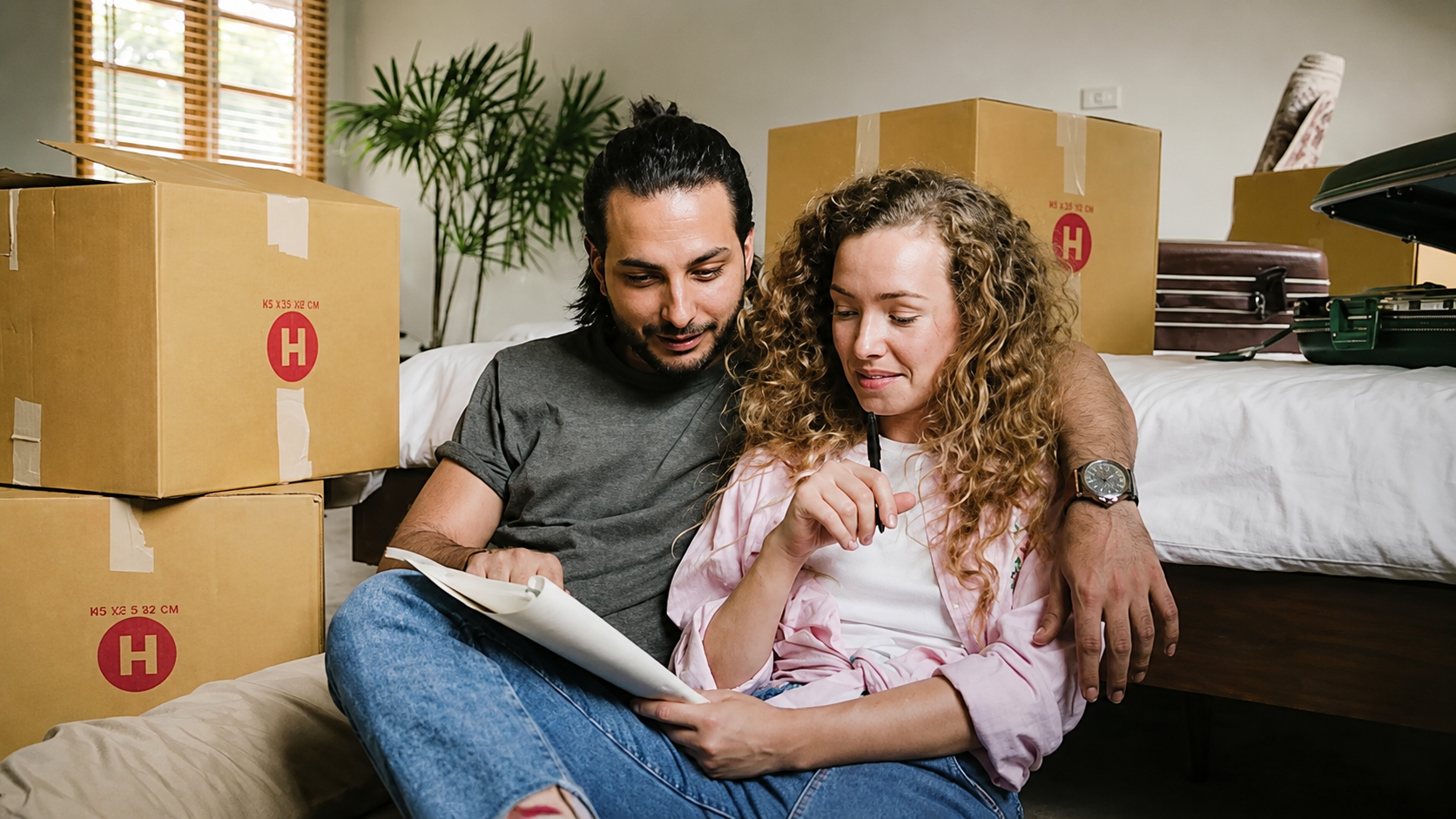 A couple reviewing paperwork together at home