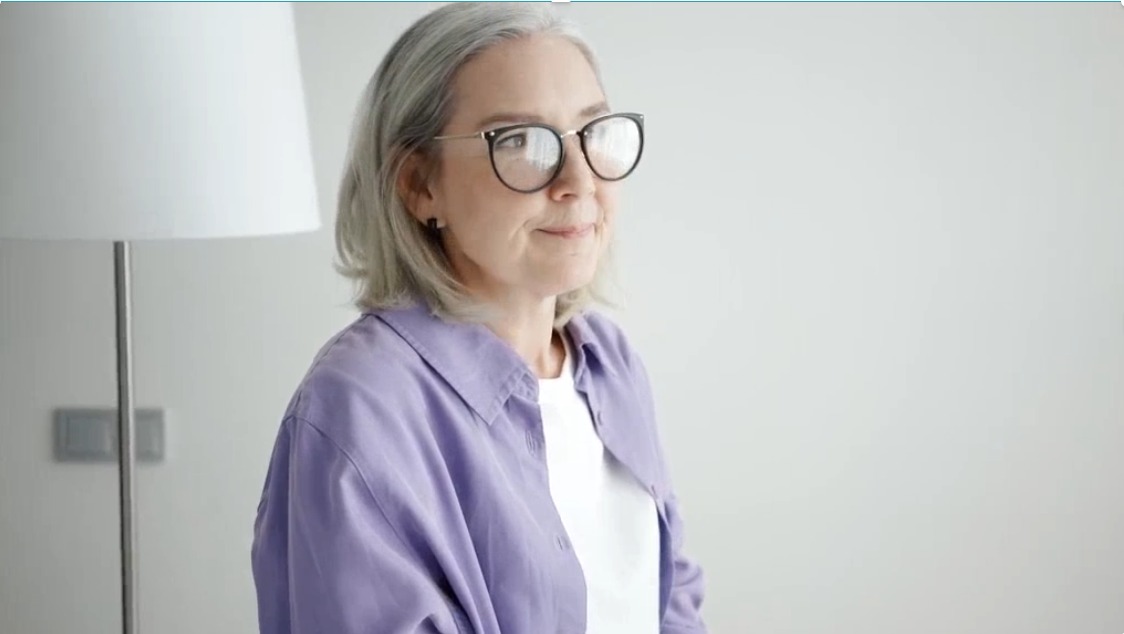 A woman reflecting quietly at home